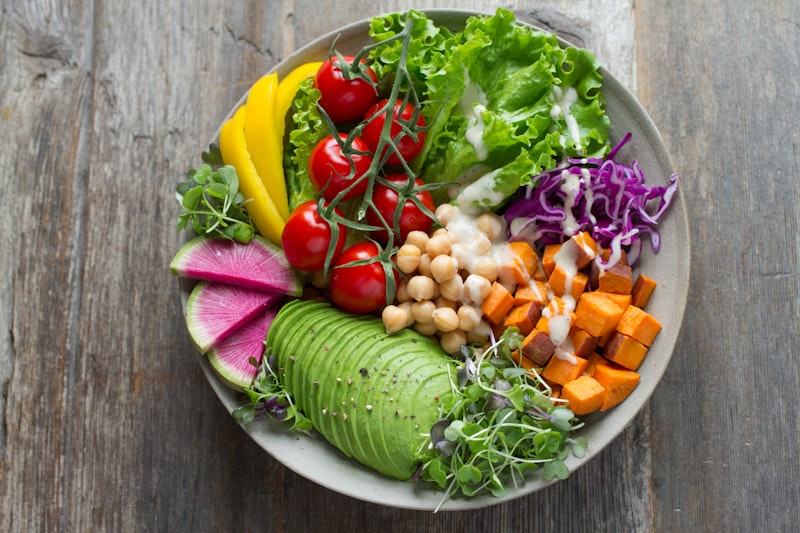 Colorful balanced meal with fresh vegetables on a wooden table